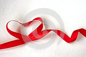 Valentines day holiday blank greeting card heart made of red satin ribbon on white background