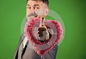 Valentines day holiday. Love. Wedding day. stylish esthete with decorative heart. bearded man in formal suit