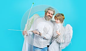 Valentines day. Little cupid boy and father with bow and arrow. Christmas angels. Cute angel.