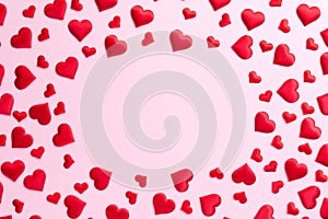 Valentines day and love concept. Red hearts background on pink