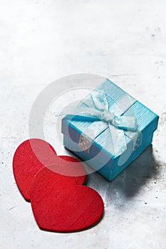 Valentines day love gift box with ribbon and red hearts