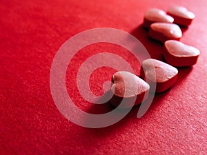 Valentines day. Love heart symbol on red background photo