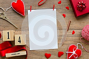 Valentines day mockup. Flat lay composition from red hearts, ribbon, perpetual calendar date 14 february, gift box, pen