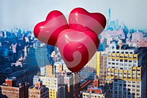 Valentines day in the New York city. Three red balloons in form of heart flying over Manhattan and skyscrapers. Ð¡oncept. America