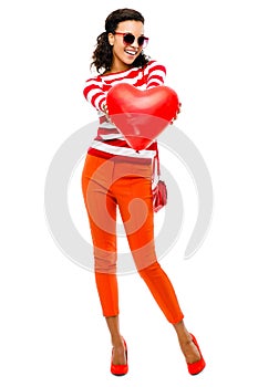 Valentines day portrait of Pretty Mixed race woman holding red h