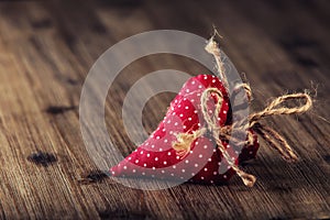 Valentines day. Red cloth handmade hearts on wooden background