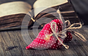 Valentines day. Red cloth handmade hearts on wooden background