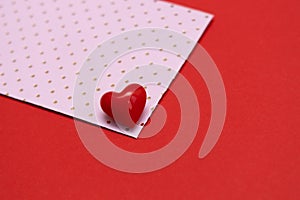 Valentines day red heart on pink dots envelope. Vivid color. Valentine's day concept. Copy space. Space for text.