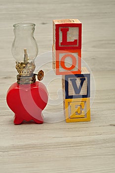 A red oil lamp in the shape of a heart with love photo