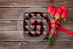 Valentines day with red roses and heart chocolate box