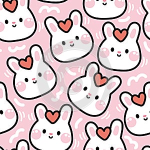 Valentines day.Seamless pattern of cute rabbit face with heart on head pink background