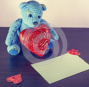 Valentines Day. Teddy Bear Loving cute with red hearts sitting alone. Vintage.