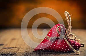 Valentines day. Wedding day. Red cloth handmade hearts on wooden background - table. Free space for your love text