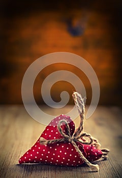 Valentines day. Wedding day. Red cloth handmade hearts on wooden background - table. Free space for your love text