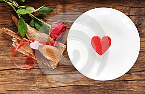 Valentines dinner romantic love food and love cooking concept / Red heart on white plate romantic table setting