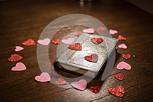 Valentines heart and bible on wooden table