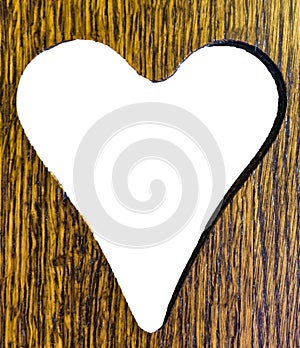 Valentines heart cut out of a wooden plank background texture