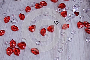 Valentines red hearts and white clear beads scattered