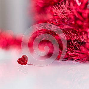 Valentinesday background with a heart and red glitter