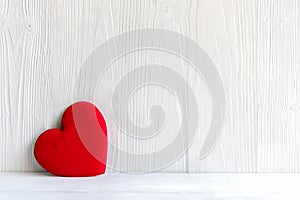 Valentineâ€™s Day. Sewed pillow red hearts clothespins on the white wood planks. Happy lovers day card mockup, copy space