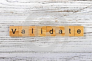 VALIDATE word made with wooden blocks concept photo