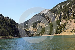 Lake and Mountain in Vall de NÃÂºria in the RipollÃÂ¨s region Spain  photo