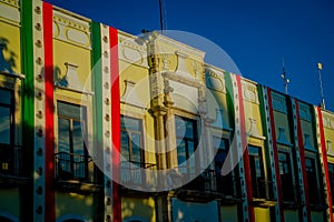 VALLADOLID, MEXICO - NOVEMBER 12, 2017: Outdoor view of a building with a mexican flag hanging in the facade in a