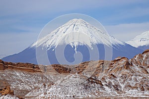 Valle de la Luna Valley of the Moon and Licancabur volcano, Atacama Desert, Chile