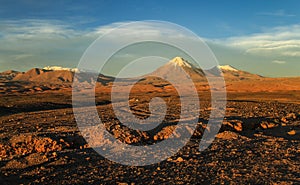 Valle de la Luna, view on the Licancabur Volcanoe at sunset, Atacame desert, Northern Chile