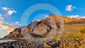 Valle Gran Rey - Scenic view during sunset on the volcanic sand beach Playa del Ingles in Valle Gran Rey, La Gomera photo