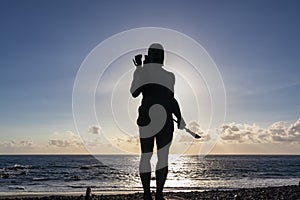 Valle Gran Rey - Silhouette of Statue of local Guanche hero, Escultura de Hautacuperche, near beach in Valle Gran Rey on La Gomera photo