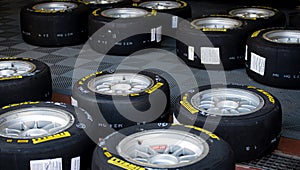 Large group of Pirelli P zero racing tire aligned on floor