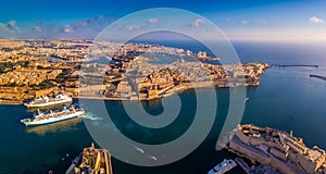 Valletta, Malta - Aerial panoramic skyline view of the Grand Harbour of Malta with cruise ships. This view includes Valletta, Flor