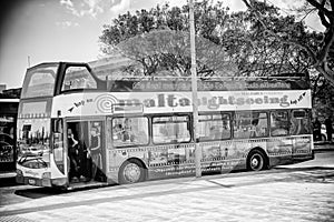 Valletta, Malta - April 17, 2022: City sightseeing bus tour along the city center