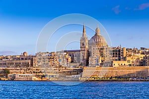 Valletta, Malta - The beautiful Saint Paul`s Cathedral and the ancient walls of Valletta in the morning