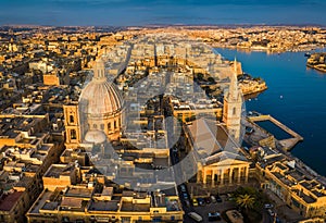 Valletta, Malta - Our Lady of Mount Carmel Church and St.Paul`s Cathedral from above at sunrise