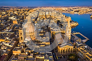 Valletta, Malta - Our Lady of Mount Carmel Church and St.Paul`s Cathedral from above at sunrise