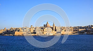 Valletta, Malta. Panoramic view of the historic island and the dome of Carmelite Church and St Paul`s tower.