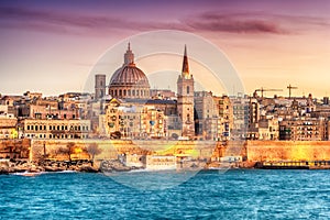 Valletta, Malta: skyline from Marsans Harbour at sunset photo