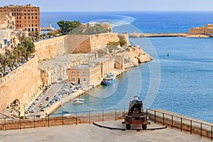 Valletta port gates and old historical canon - Malta