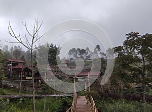 Valley and Bukit Sibajag Green Canyon Temanggung is a recreation in the wild with a path of bamboo