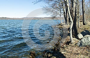Valley Cottage, NY / United States - Mar. 14, 2020: A landscape view of New York State Rockland Lake Park`s  lake, shoreline and