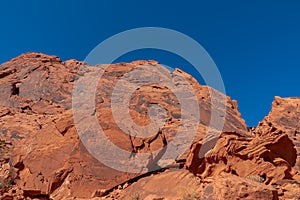 Valley of Fire - Panoramic view of red Aztek sandstone rock formations in Petroglyph Canyon along Mouse Tank hiking trail, Nevada