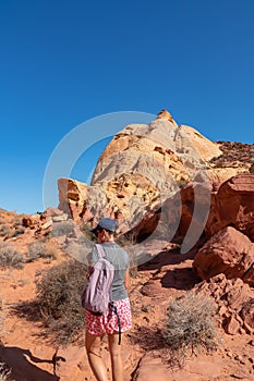 Valley of Fire - Woman hiking in Petroglyph Canyon on Mouse Tank trail in Valley of Fire State Park in Mojave desert, Nevada, USA
