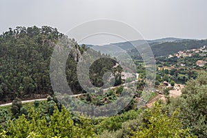 Valley between forest mountains with Mondego river and Reconquinho beach in aerial view, Penacova PORTUGAL