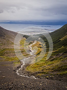 Valley of the Martial glacier and his river with Ushuaia and the Beagle channel in the back