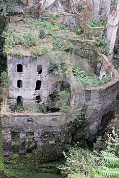 Valley of the mills, abandoned mills amidst undergrowth at the foot of a ravine in the old town of Sorrento, Amalfi Coast, Italy.