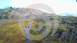 Valley National Park, aerial view. Landmannalaugar. On the gentle slopes of the mountains are snow fields and glaciers.