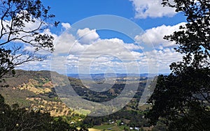 Valley View with vivid blue sky and white clouds and trees