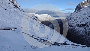 Valley viewpoint of Visitor centre on Trollstigen road in snow in Norway in autumn